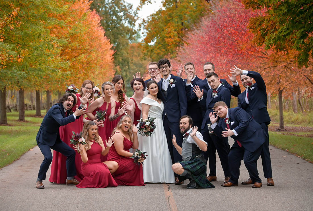 The wedding party and all their goofiness rocking the heck out of fall colors at the Bull Estate at Addison Oaks in Leonard, Michigan.