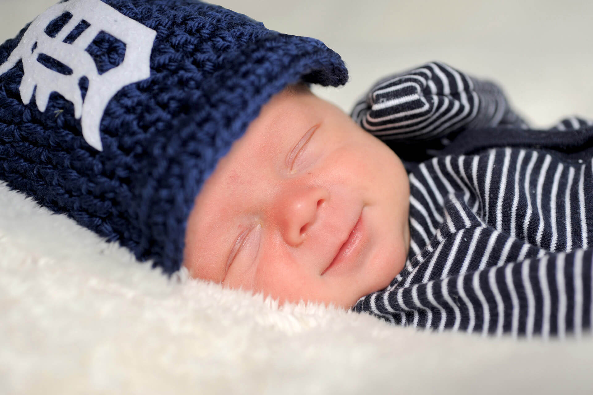 Best Detroit infant photographer usually has a lot of baby photography sessions in her Troy, Michigan studio like this Detroit Tiger fan infant in metro Detroit, Michigan.