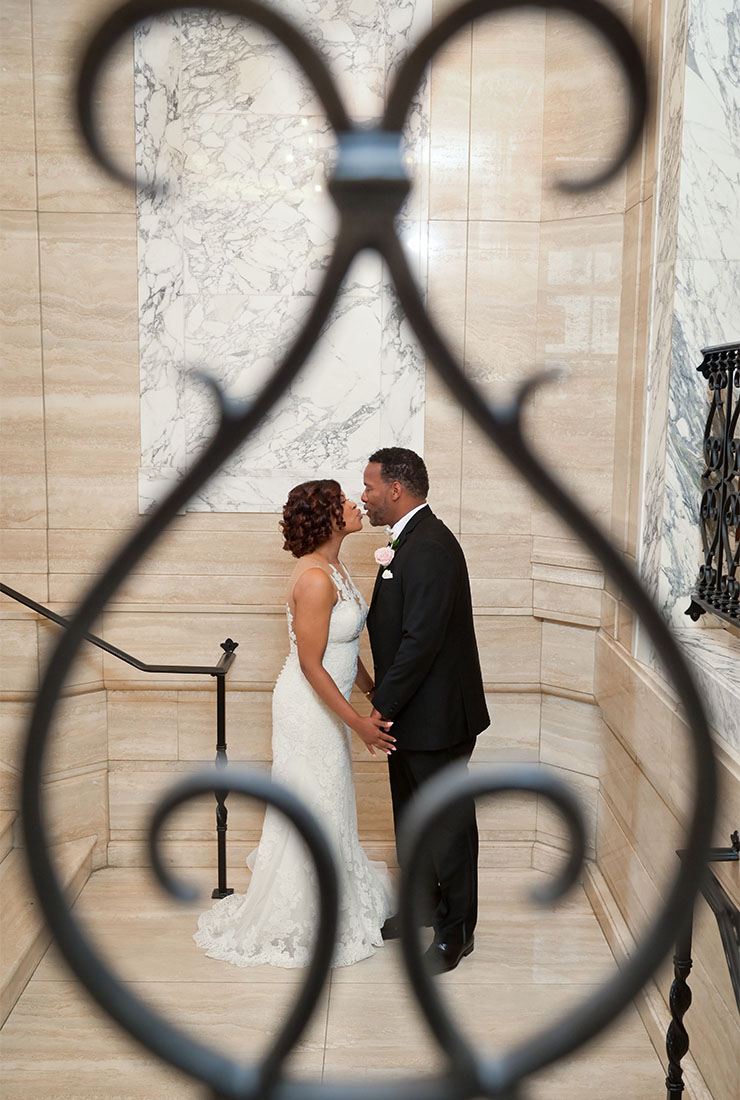 The groom and bride during their first look at the Book Cadillac Hotel in Detroit, Michigan.
