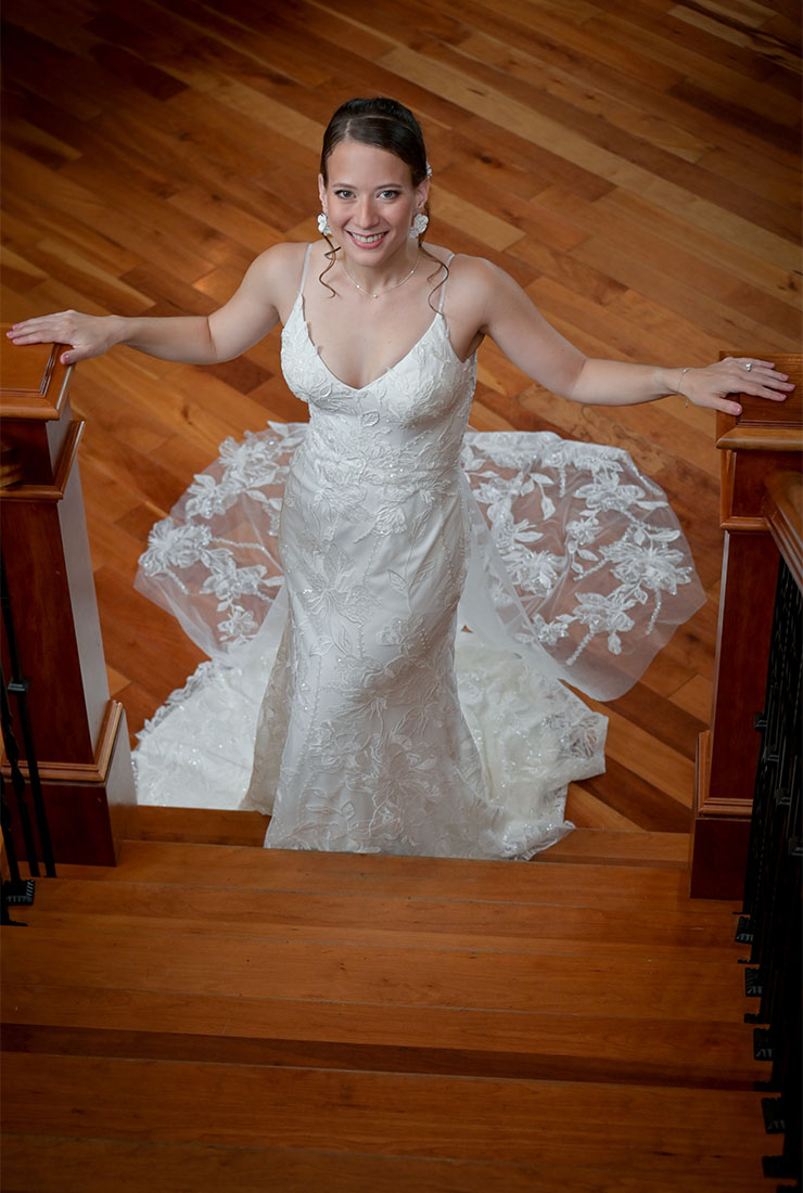 The bride waits for me at the bottom of the stairs in Burlington, Vermont.