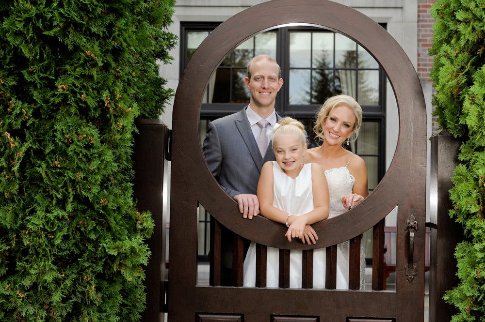 A Rochester, Michigan wedding features a couple and their daughter at their Royal Park Hotel wedding in Rochester, Michigan.