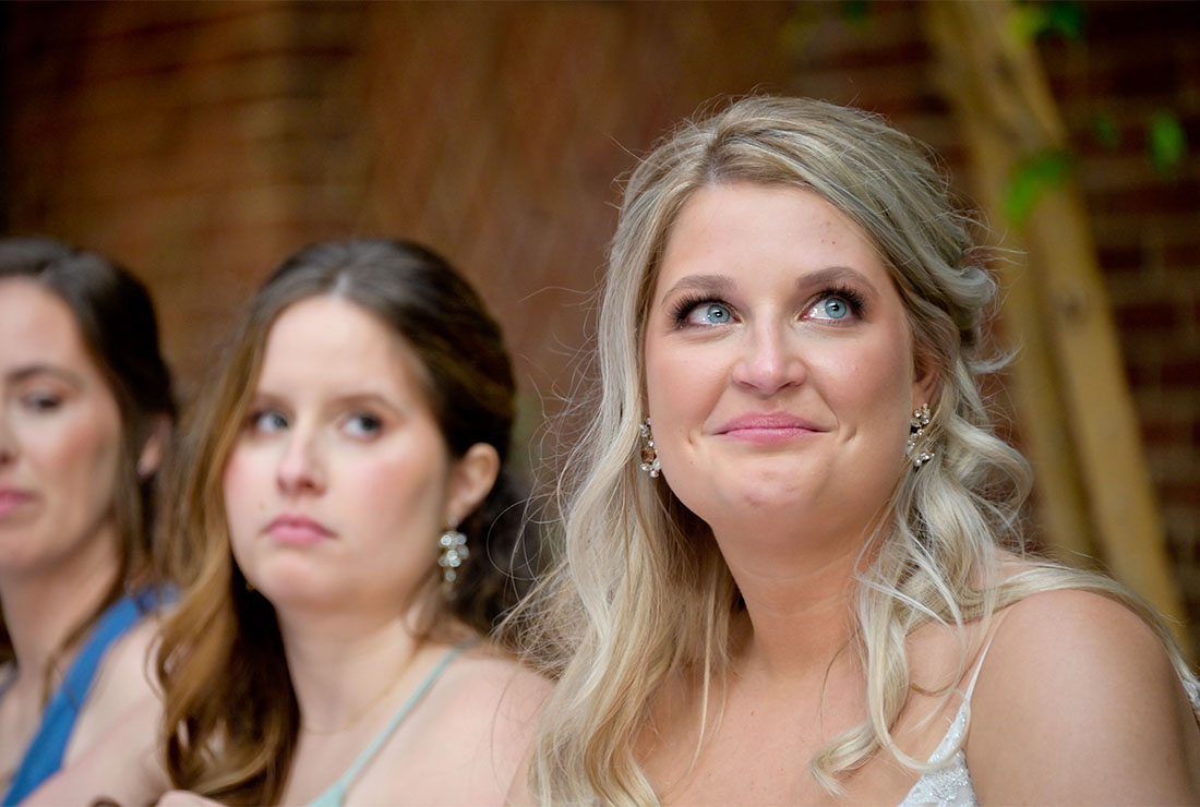 The bride tears up during speeches at St. Johns Resort in Plymouth, Michigan.