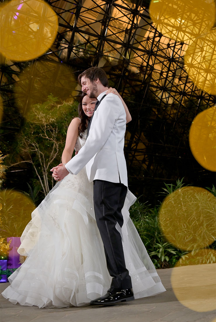 The bride and groom's first dance in the giant greenhouse at the Westin Southfield in Southfield, Michigan.