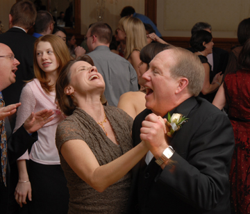 The father of the bride lets loose while dancing at the Troy, Michigan wedding reception