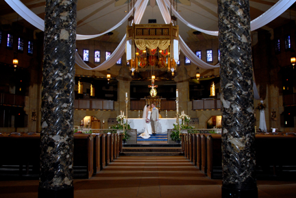 The catholic church is lit for photos after the couple's ceremony in Royal Oak, MI