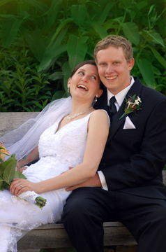The bride and groom cuddle after their ceremony at the Ann Abor Botanical gardens