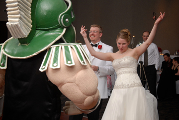 The bride gets ready to tango with sparty at their Sterling Heights, MI reception