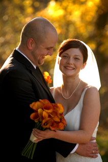 The bride and groom share a moment in beautiful fall light at Addison Oaks in Romeo Michigan