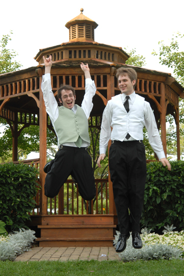 The groom and best man chest bump after the ceremony