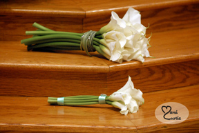 The Bride and maid of honor's flowers sit on the altar steps during the wedding ceremony in Macomb, MI