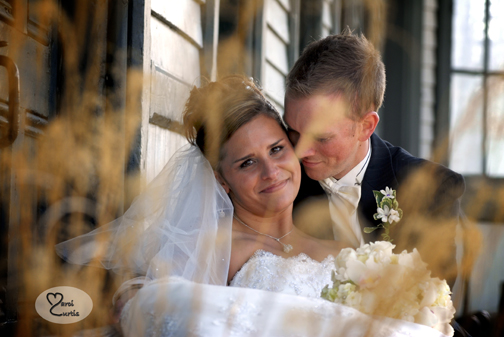 The bride and groom snuggle during photos in Chelsea, Michigan