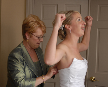 The bride triumphs over her dress on her wedding day in Troy, Michigan