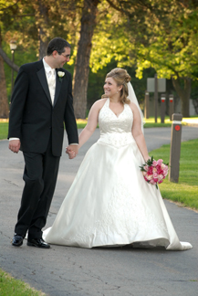 Addison Oaks couple goes for a walk before their Mi wedding reception.