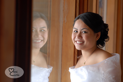 The bride is reflected in the Midland church's window