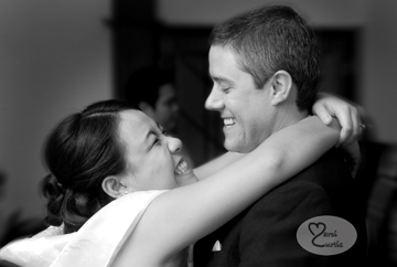 The bride and groom snuggle during dancing at their Midland, Michigan wedding reception.