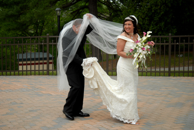 Groom gets caught in bride's veil after Black River Country Club wedding in Michigan