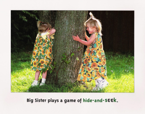 Michigan children's book writer and illustrator shows pages from the book big sister, little sister