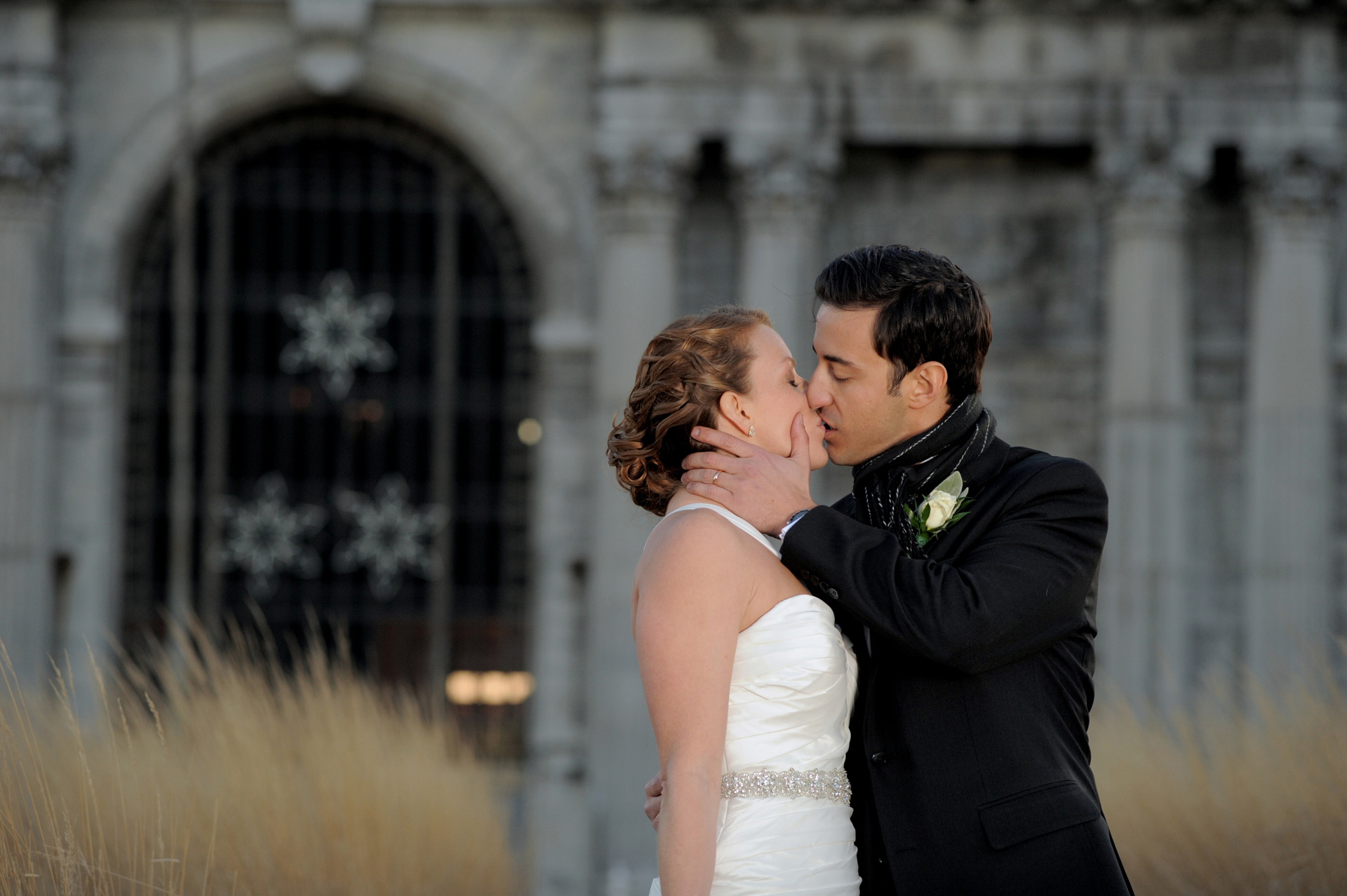 The Historic church Sweetest Heart of Mary and the Dearborn Inn of Detroit's historic church in Detroit and Dearborn, Michigan wedding photographer's photo of the wedding couple at Detroit's historic train station for wedding photos in Detroit, Michigan.