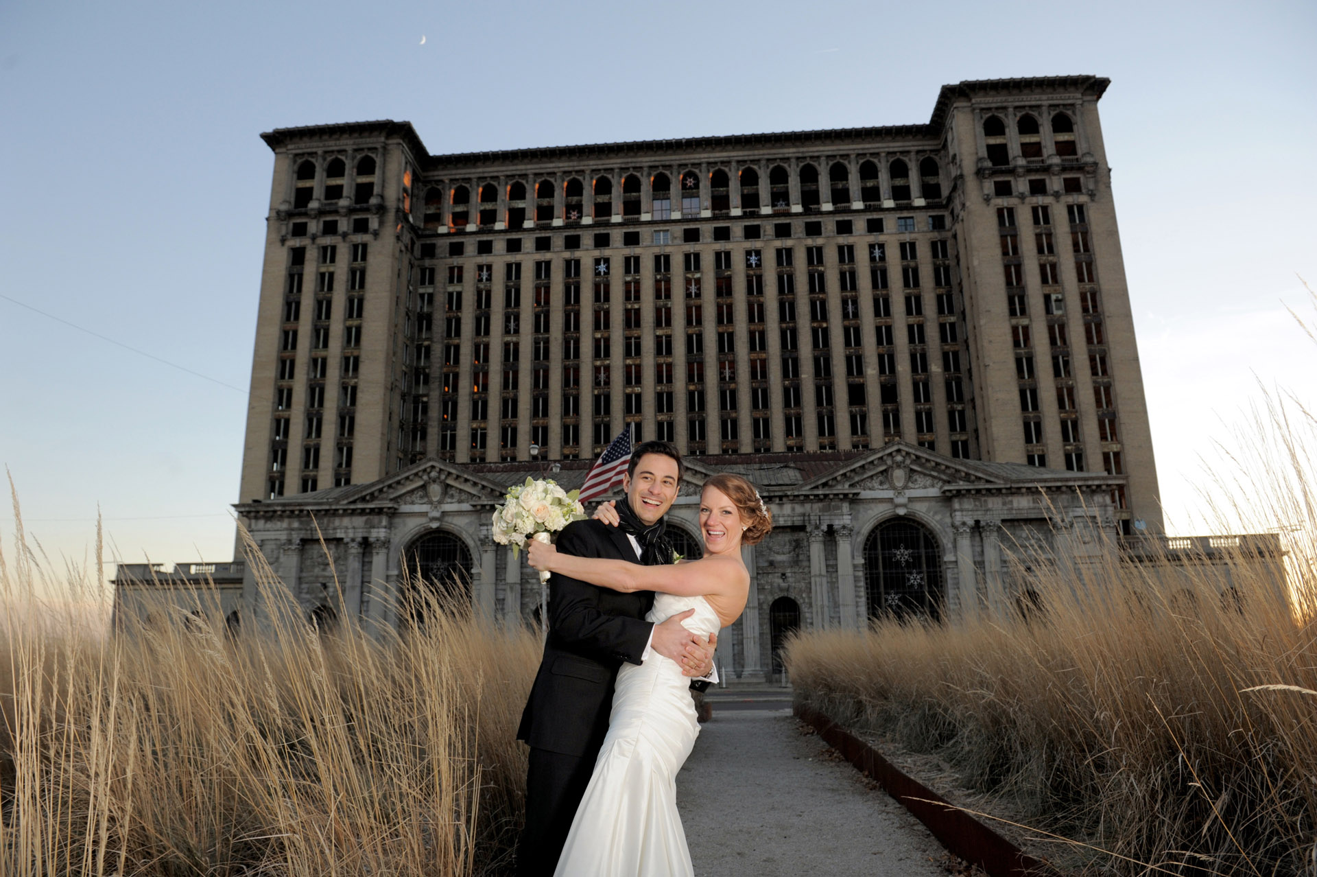 The Historic church Sweetest Heart of Mary and the Dearborn Inn of Detroit's historic church in Detroit and Dearborn, Michigan wedding photographer's photo of the the bride and groom at Detroit's historic train station for wedding photos in Detroit, Michigan.
