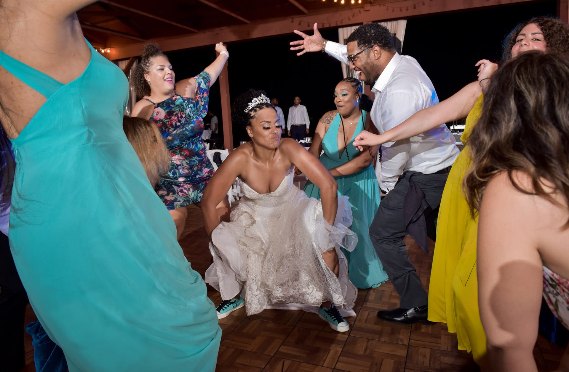 A bride takes the dance floor by storm after during her wedding reception at Fox Hills Golf Course in Plymouth, Michigan.