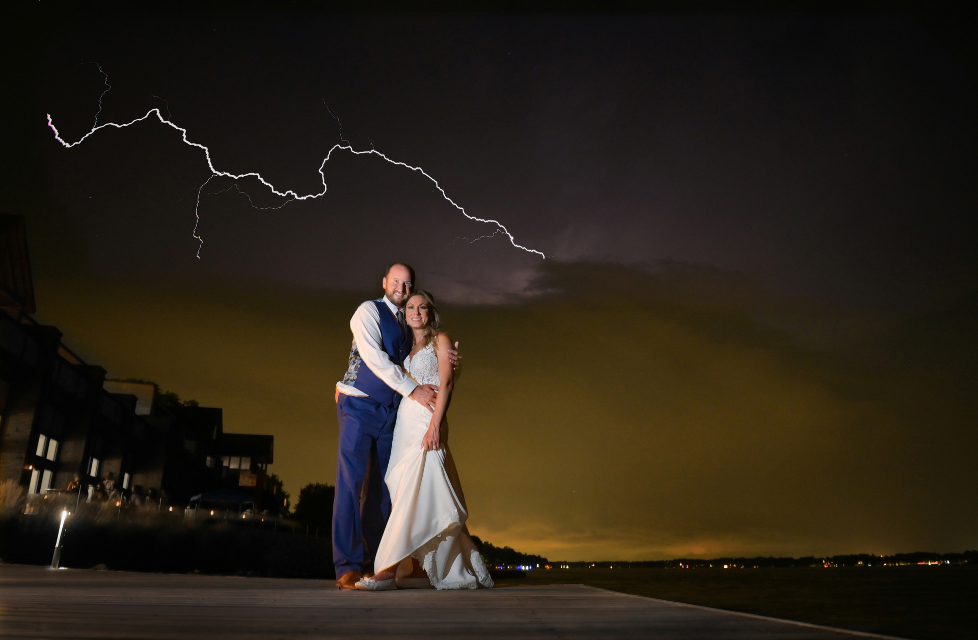 The bride and groom take a quick photo during their wedding reception at the St. Clair Inn in St. Clair Michigan just as a weird summer storm blew in from the lake.