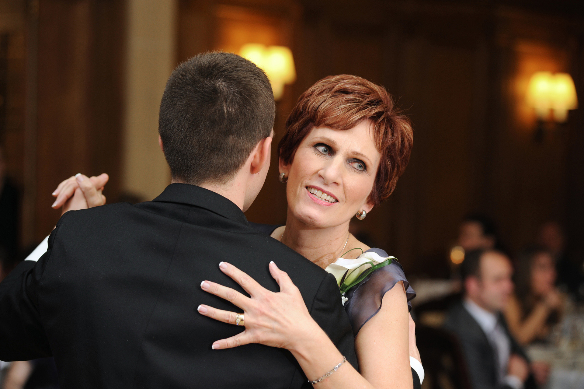 Michigan wedding at Detroit, Michigan, Michigan wedding shows a photograph of the groom dancing with his mother during the wedding reception at the Detroit Athletic Club.