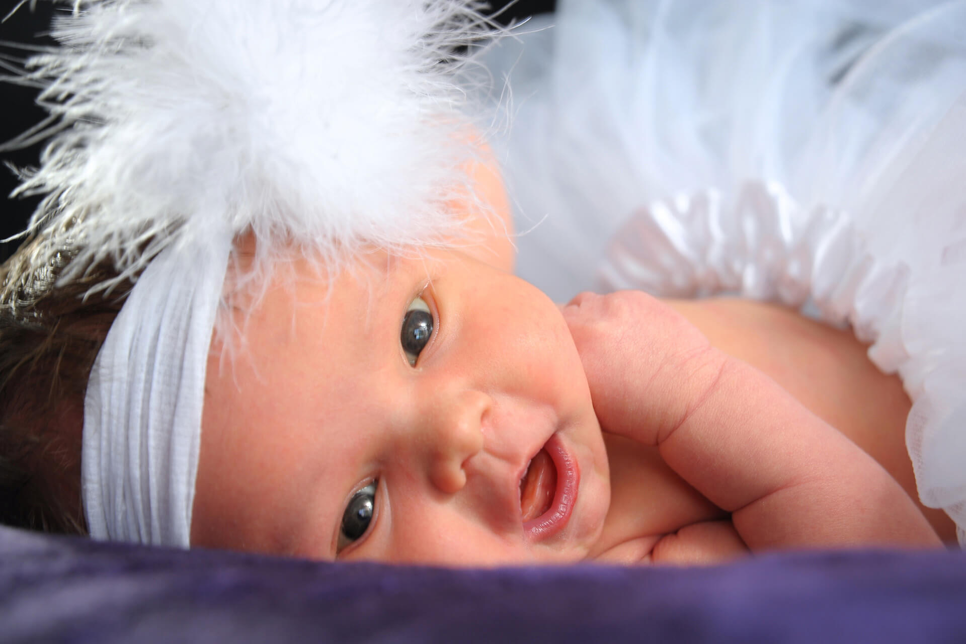 Best Detroit baby photographer' blends classic newborn photography sessions with lots of fun like this flapper baby in the metro Detroit, Michigan area.