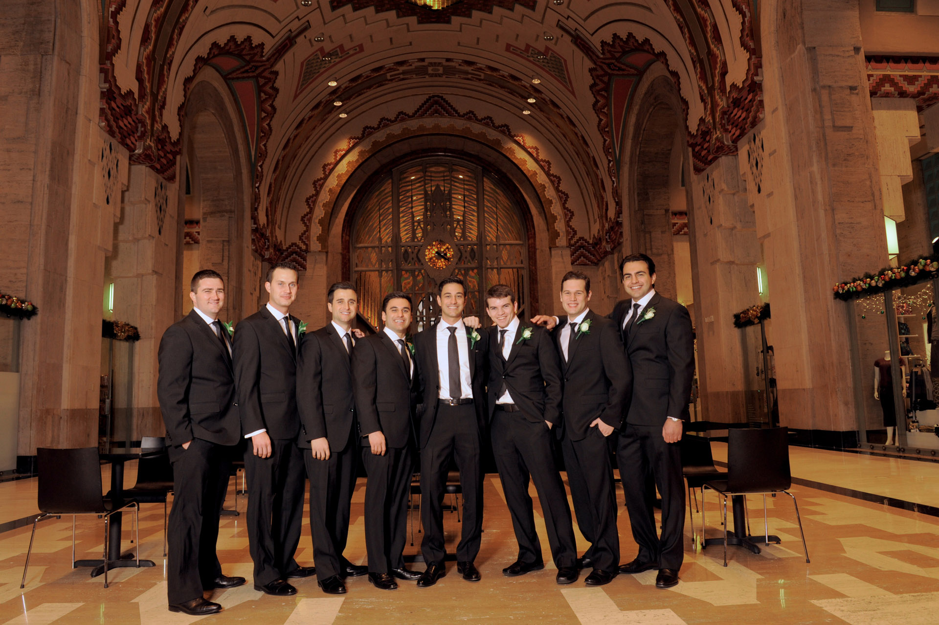 The Historic church Sweetest Heart of Mary and the Dearborn Inn of Detroit's historic church in Detroit and Dearborn, Michigan wedding photographer's photo of the groomsman at the historic Guardian building for wedding photos in Detroit, Michigan.