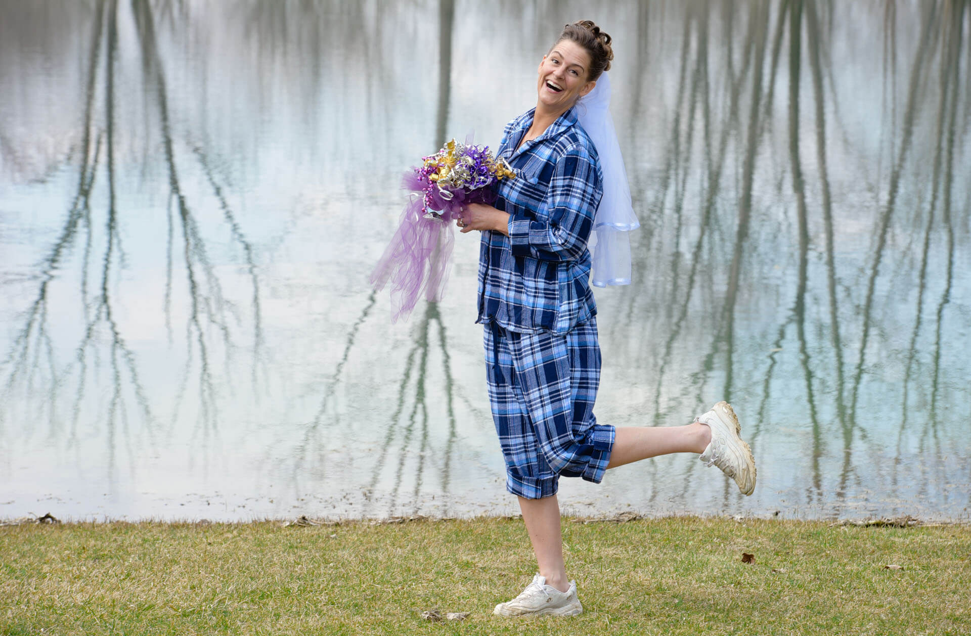 Epic wedding portrait of the bride posing at her country home in her pajamas before finishing getting ready for her wedding in Metro Detroit, Michigan.