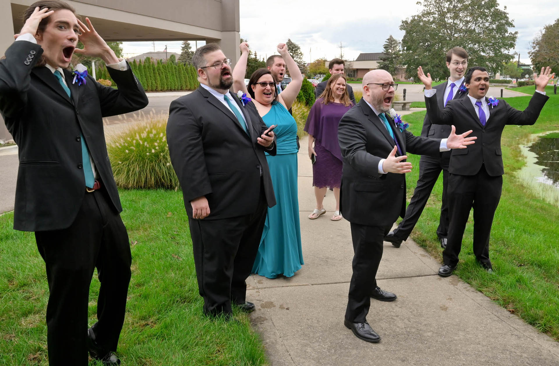 The bridal party react to seeing the brides 