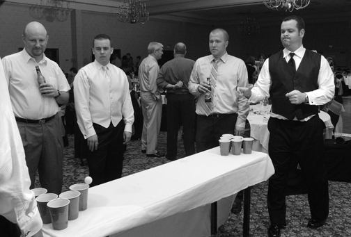 Michigan wedding photojournalist takes wedding photgraphs during the reception