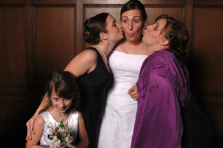 Wedding photobooth photo of wedding guests doing strange things.
