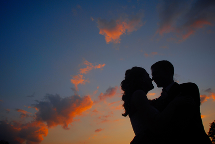 Dearborn Heights, Michigan couple kisses in the sunset.