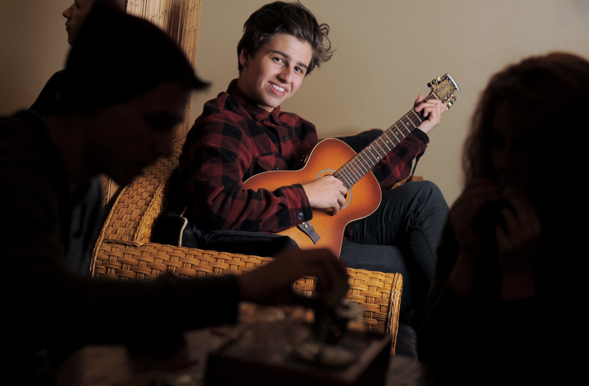 A Royal Oak, Michigan senior hangs out at his favorite coffee bar playing his guitar in this unique senior photo.